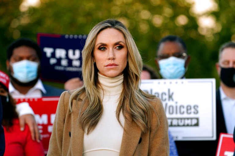 Lara Trump, daughter-in-law of President Donald Trump listens to Rudy Giuliani, a lawyer for President Trump, speak during a news conference on legal challenges to vote counting in Pennsylvania, Wednesday, Nov. 4, 2020, in Philadelphia.