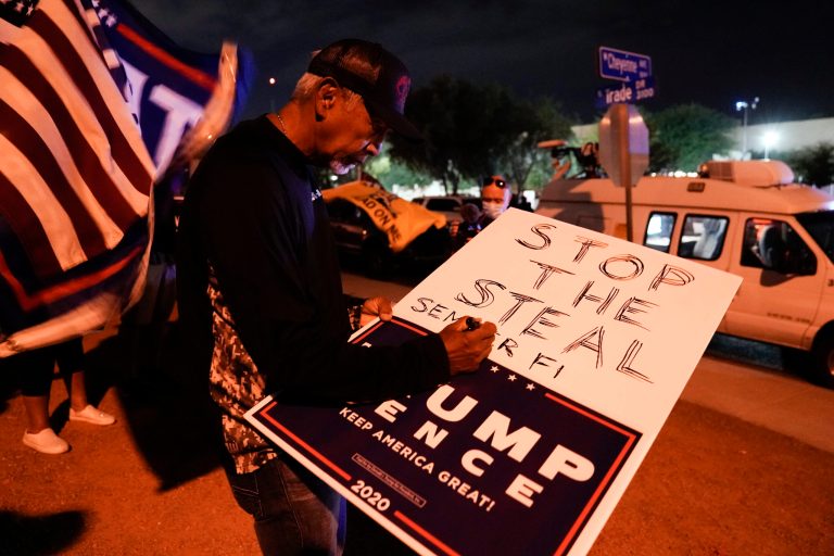 Supporters of President Donald Trump protest in front of the Clark County Election Department after the Nov. 3 elections, Friday, Nov. 6, 2020, in North Las Vegas, Nev.