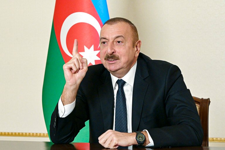 In this handout photo provided Wednesday, Nov. 25, 2020, by the Azerbaijan's Presidential Press Office, Azerbaijani President Ilham Aliyev gestures as he addresses the nation in Baku, Azerbaijan.