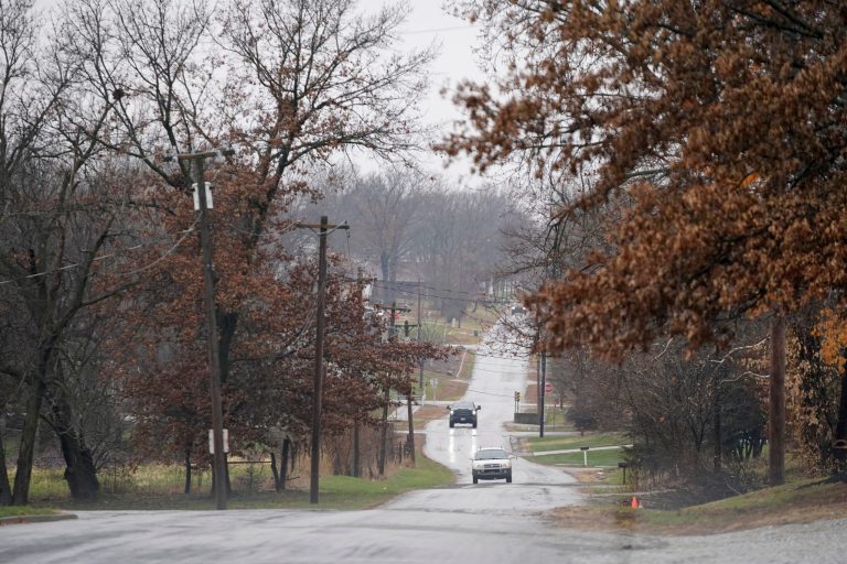 Cars drive on a road near Scotland County Hospital Tuesday, Nov. 24, 2020, in Memphis, Mo. (AP Photo/Jeff Roberson)