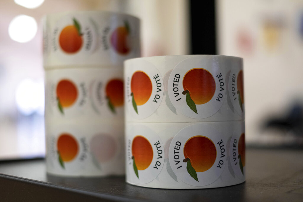 Georgia’s high-stakes Senate election runoff voting begins