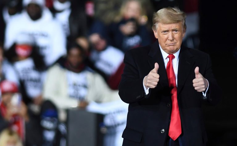 Donald Trump gives a thumbs up after speaking at a Republican National Committee Victory Rally at the Dalton Regional Airport.
