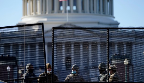 Black Lives Matter protesters clash with police over Capitol Hill fence