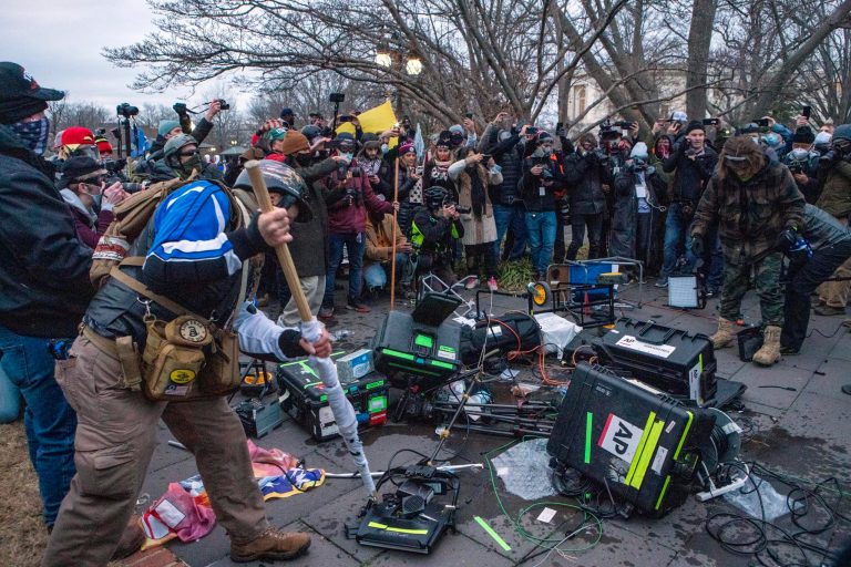 Support of President Donald Trump break TV equipment outside the the U.S. Capitol on Wednesday. A new poll found voters blame the media even more than Trump for the incivility in the nation.