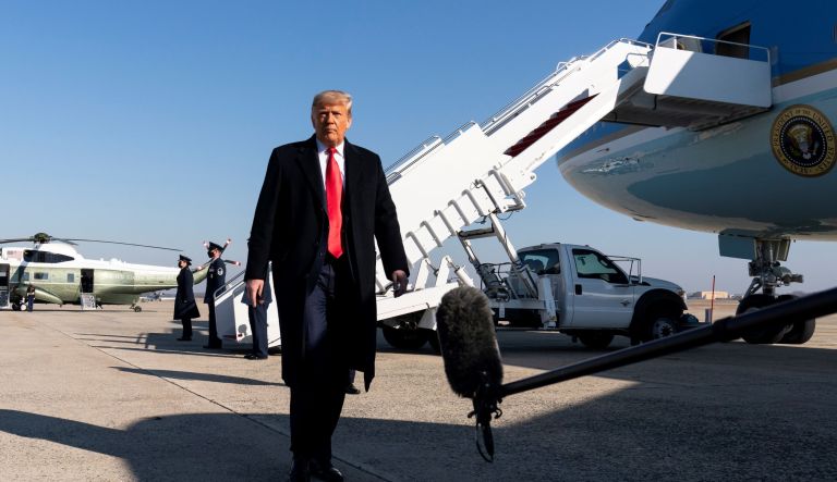 President Trump talks to reporters on his way to Texas