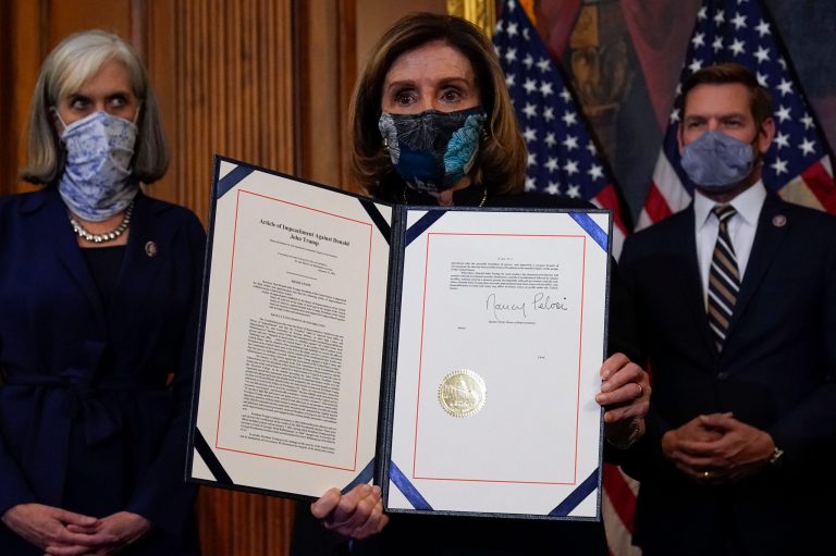 House Speaker Nancy Pelosi of Calif., with the signed article of impeachment against President Donald Trump, endorsed former Virginia Terry McAuliffe's bid for a second term