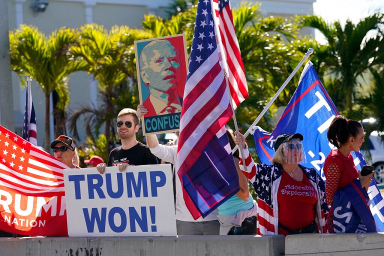 Hundreds of Trump supporters line streets welcoming him to post-presidency life at Mar-a-Lago