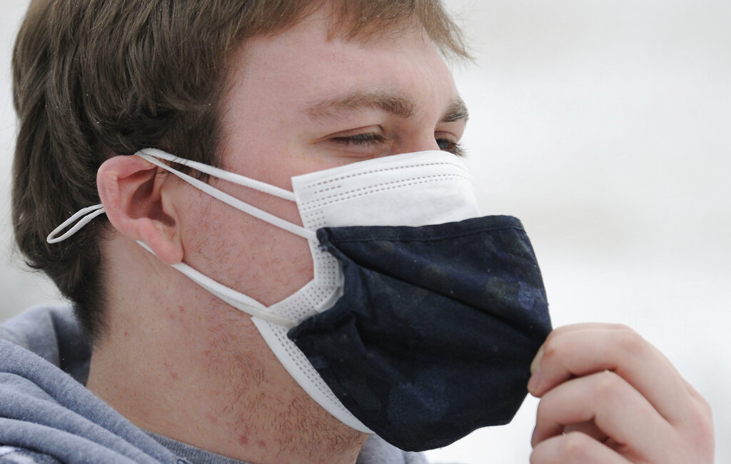 UK infectious disease expert advises people wear masks with three layers