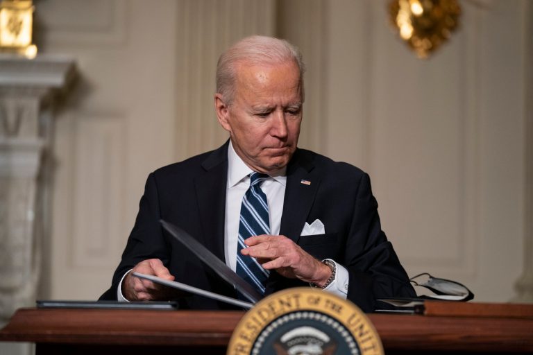 President Joe Biden signs a series of executive orders on climate change, in the State Dining Room of the White House, Wednesday, Jan. 27, 2021, in Washington.