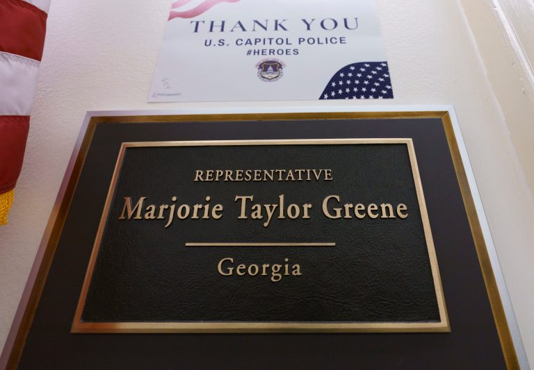 The sign for the office of Rep. Marjorie Taylor Greene, R-Ga., is seen on Capitol Hill in Washington, Wednesday, Feb. 3, 2021. House Democrats are threatening to have her removed from her committee assignments.