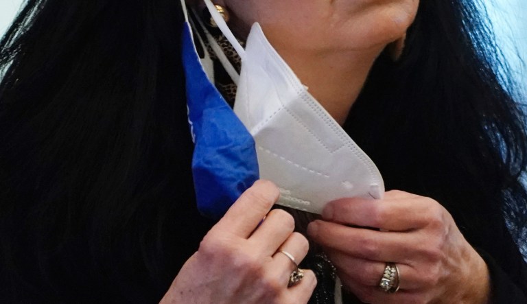Sen. Angela Hill, R-Picayune, adjusts her face masks while asking a question as lawmakers discuss and debate bills in their chamber at the Capitol in Jackson, Miss., Thursday, Feb. 4, 2021.