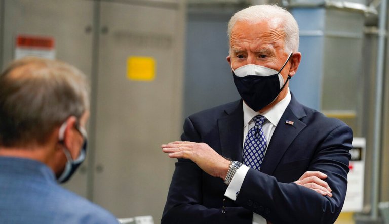 President Joe Biden tours a Pfizer manufacturing site, Friday, Feb. 19, 2021, in Portage, Mich.