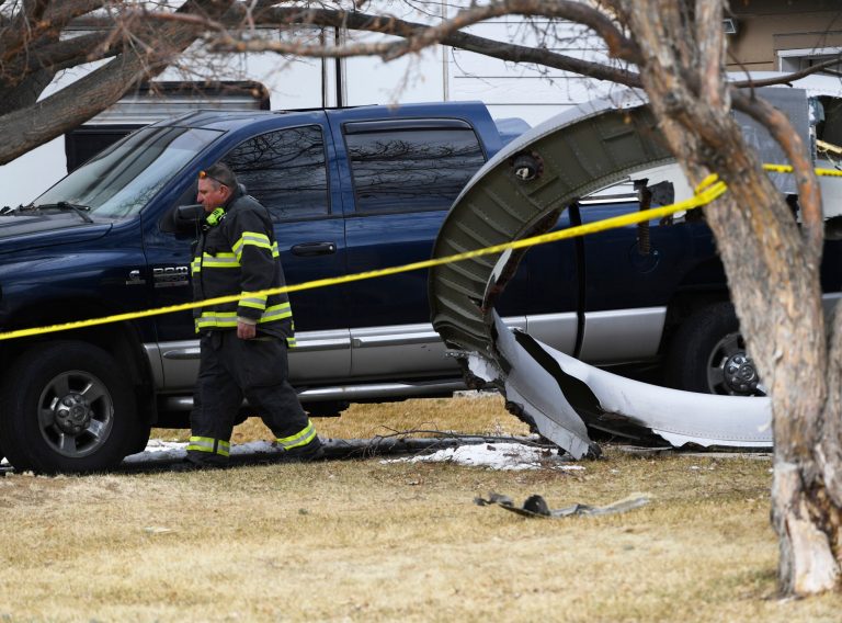 Pilot called ‘mayday, mayday’ during engine failure on United Airlines flight from Denver airport: Flight audio A North Metro firefighter walks past a large piece of an airplane engine in the front yard of a home on Elmwood Street near E. 13th Avenue, Saturday, Feb. 20, 2021, in Broomfield, Colo. (Andy Cross/The Denver Post via AP)