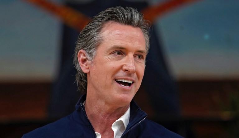 In this Feb. 21, 2021, file photo, California Gov. Gavin Newsom takes questions from the media during a visit to a mobile vaccination site at Ramona Gardens Recreation Center in Los Angeles.