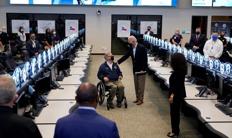 President Joe Biden talks with Texas Gov. Greg Abbott as they tour the Harris County Emergency Operations Center, Friday, Feb. 26, 2021, in Houston. 