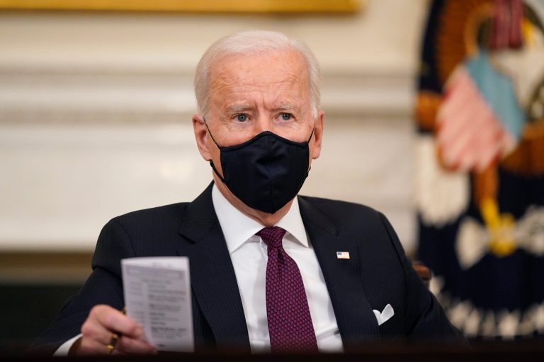 President Joe Biden participates in a roundtable discussion on a coronavirus relief package in the State Dining Room Friday.