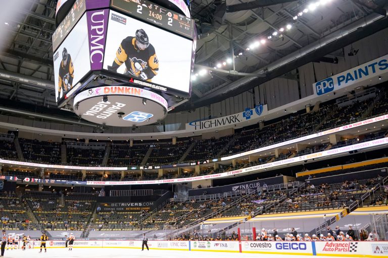 Social media users erupt with criticism after professional hockey team doctored photo to show attendees wearing masks