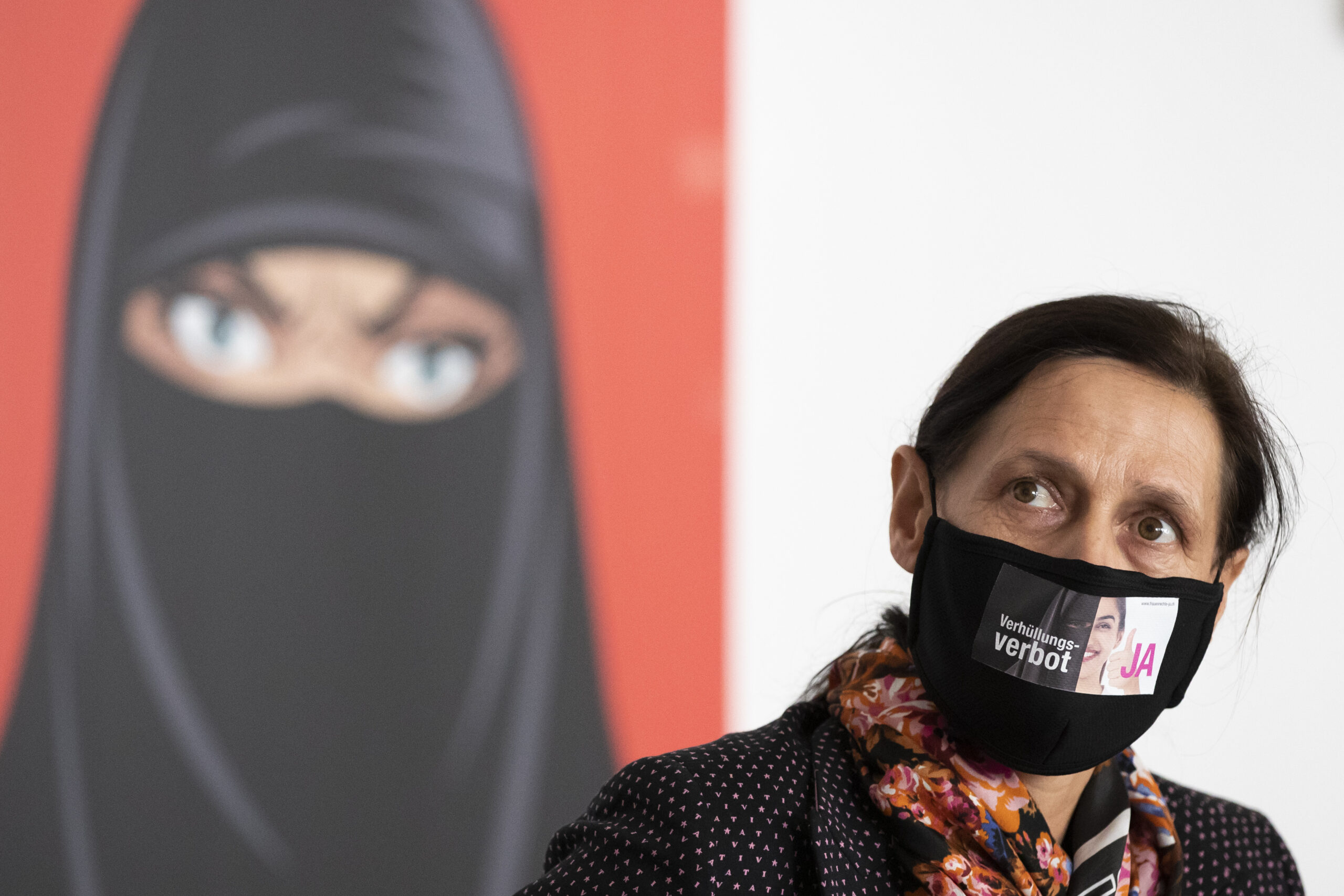 Switzerland bans face coverings in narrow vote