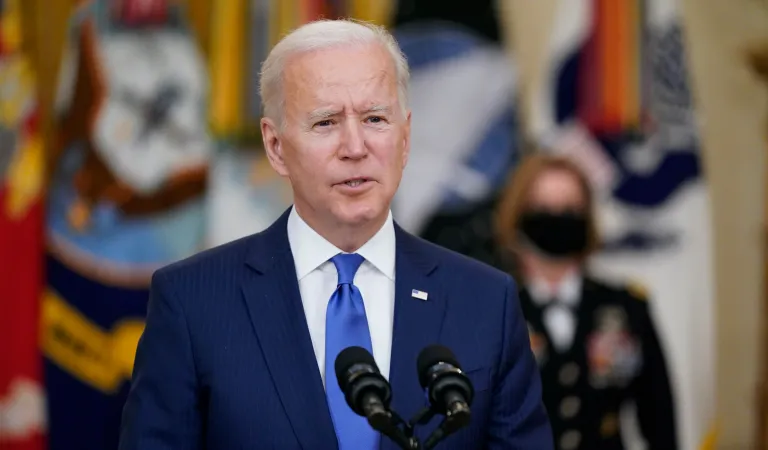 Biden spikes political football as he signs massive spending bill into law