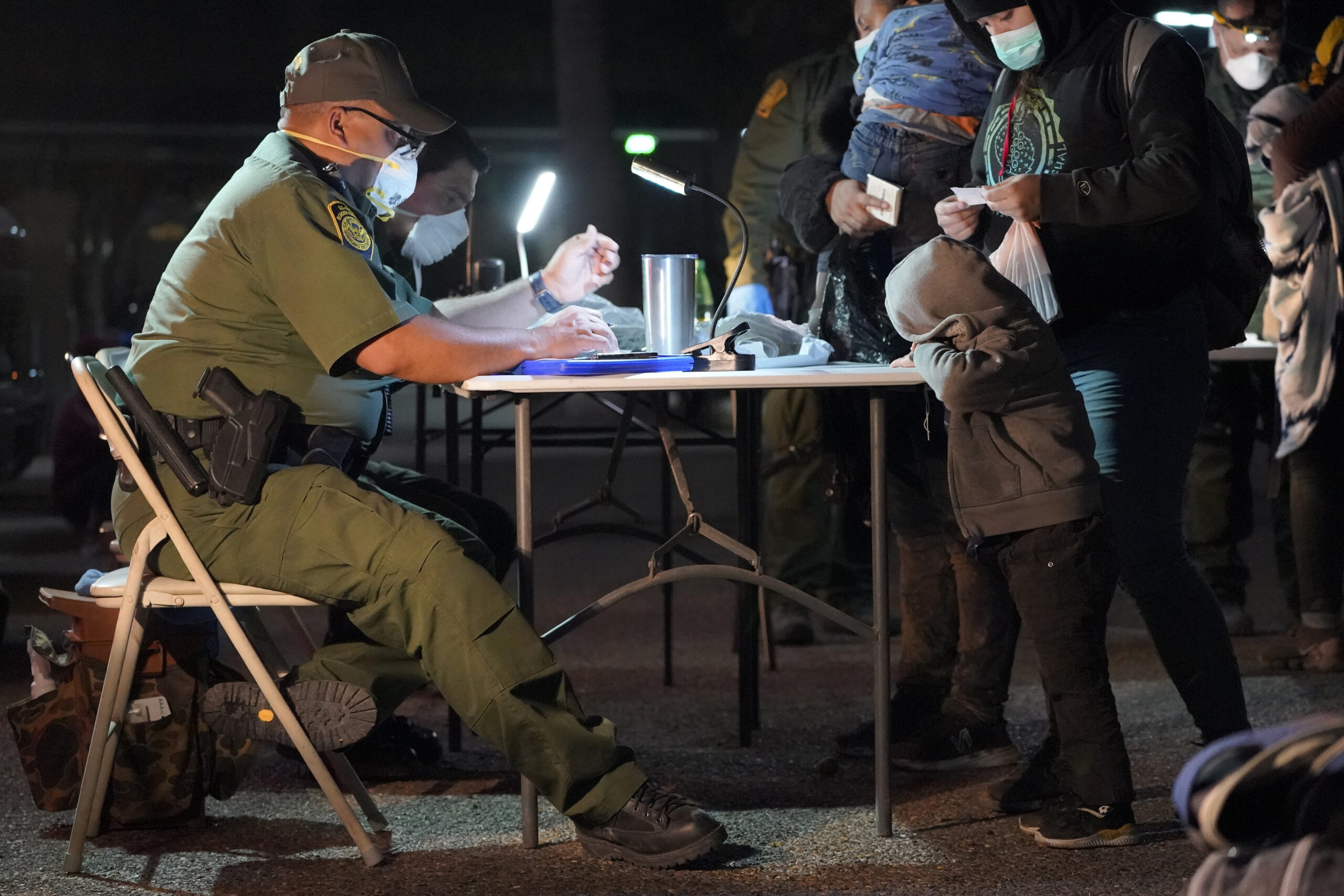 Shocking video: Migrants housed under a bridge and fenced in