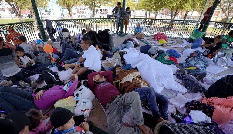 A group of migrants rest on a gazebo at a park after the deportees from the U.S. were pushed by Mexican authorities off an area they had been staying after their expulsion, Saturday, March 20, 2021, in Reynosa, Mexico.