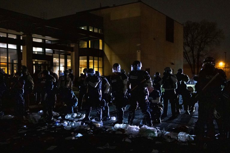 Authorities respond to a scene in front of the Brooklyn Center Police station on Sunday, April 11, 2021, in Brooklyn Center, Minn. (AP Photo/Christian Monterrosa)