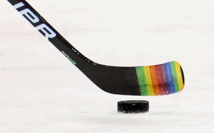 Zac Jones of the New York Rangers skates with a stick decorated for "Pride Night" in warmups prior to the game against the Washington Capitals Monday, May 3, 2021, in New York City. 