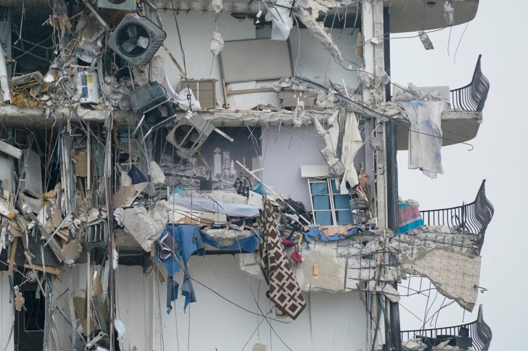 Part of a building is shown after a partial collapse.