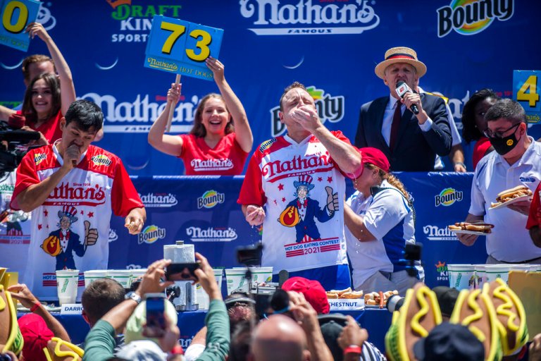 Winner Joey Chestnut competes in the Nathan's Famous Fourth of July International Hot Dog-Eating Contest in Coney Island's Maimonides Park on Sunday, July 4, 2021, in the Brooklyn borough of New York. Chowdown champ Joey âJawsâ Chestnut broke his own record to gulp to a 14th win.