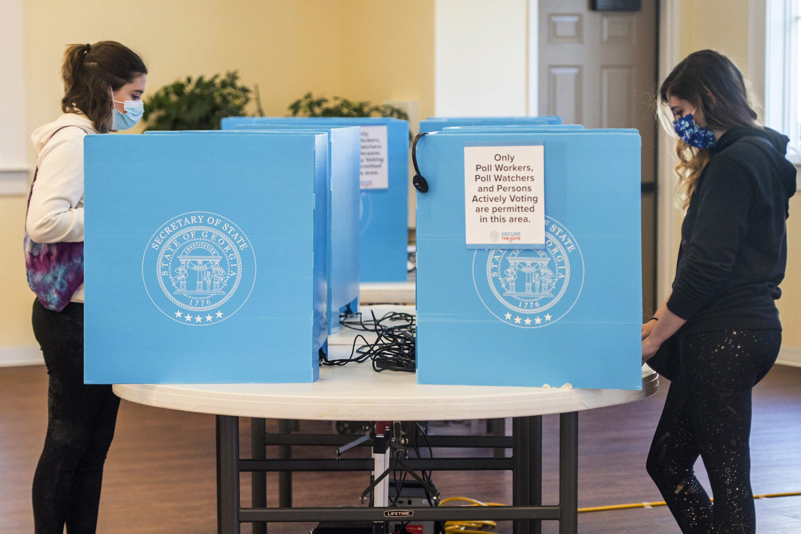 Federal judge halts effort to block portions of Georgia voting law