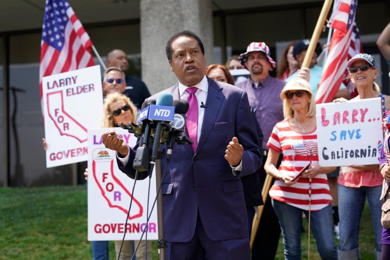 FILE â In this July 13, 2021 file photo radio talk show host Larry Elder speaks to supporters during a campaign stop in Norwalk, Calif.