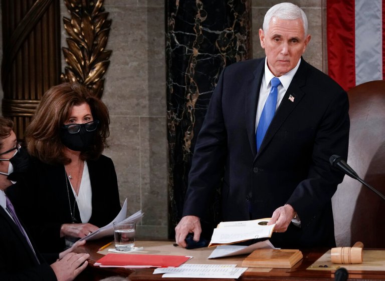 In this Jan. 6, 2021, file photo, Senate Parliamentarian Elizabeth MacDonough, second from left, works beside Vice President Mike Pence during the certification of Electoral College ballots in the presidential election, in the House chamber at the Capitol in Washington.