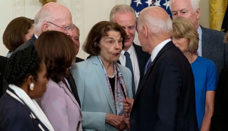 After running out of pens, Sen. Dianne Feinstein, D-Calif., center, reacts as President Joe Biden is given another pen by an aide to hand off to her after he signed H.R. 1652, the VOCA Fix to Sustain the Crime Victims Fund Act of 2021, in the East Room of the White House, Thursday, July 22, 2021, in Washington. 