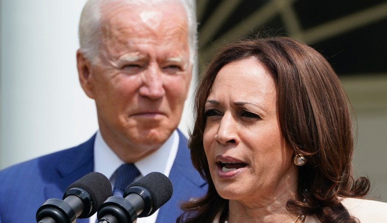 President Joe Biden, left, listens as Vice President Kamala Harris, right, speaks during an event in the Rose Garden of the White House in Washington, Monday, July 26, 2021, to highlight the bipartisan roots of the Americans with Disabilities Act and marking the law's 31st anniversary.