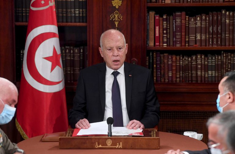 Tunisia's President Kais Saied, center, leads a security meeting with members of the army and police forces in Tunis, Tunisia, Sunday, July 25, 2021. Troops surrounded Tunisia's parliament and blocked its speaker Rached Ghannouchi from entering Monday after the president suspended the legislature and fired the prime minister following nationwide protests over the country's economic troubles and the government's handling of the coronavirus crisis. (AP Photo/Slim Abid)