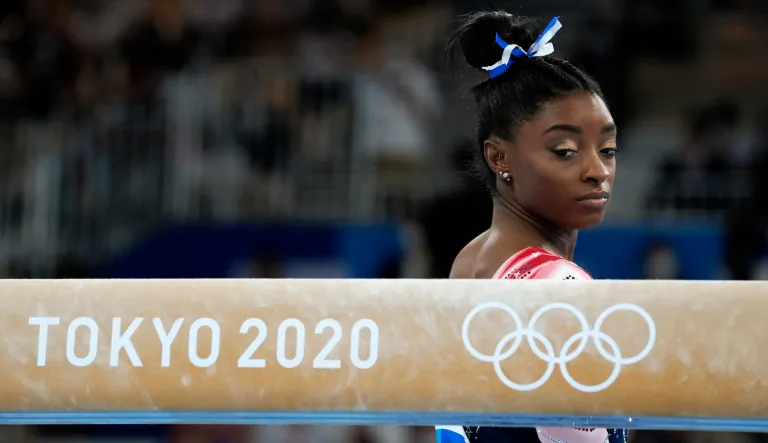 Simone Biles, of the United States, prepares to start her performance on the balance beam during the artistic gymnastics women's apparatus final at the 2020 Summer Olympics, Tuesday, Aug. 3, 2021, in Tokyo, Japan.