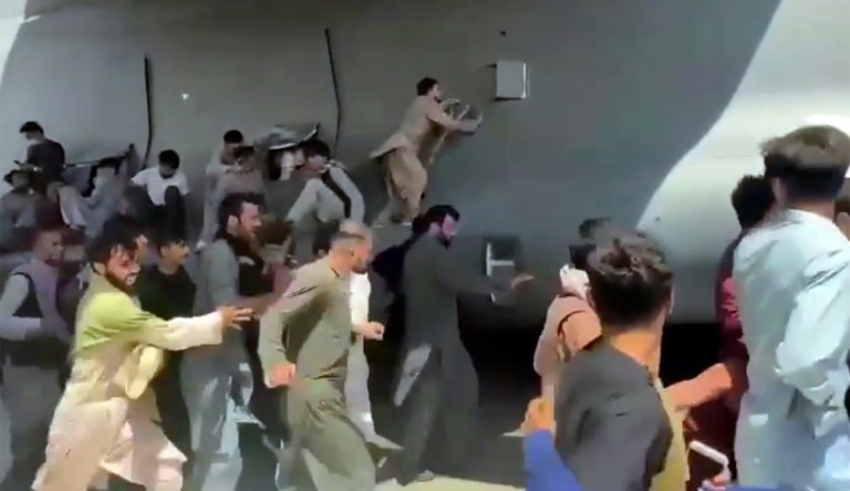 Man records himself clinging to US plane as it takes off from Kabul airport