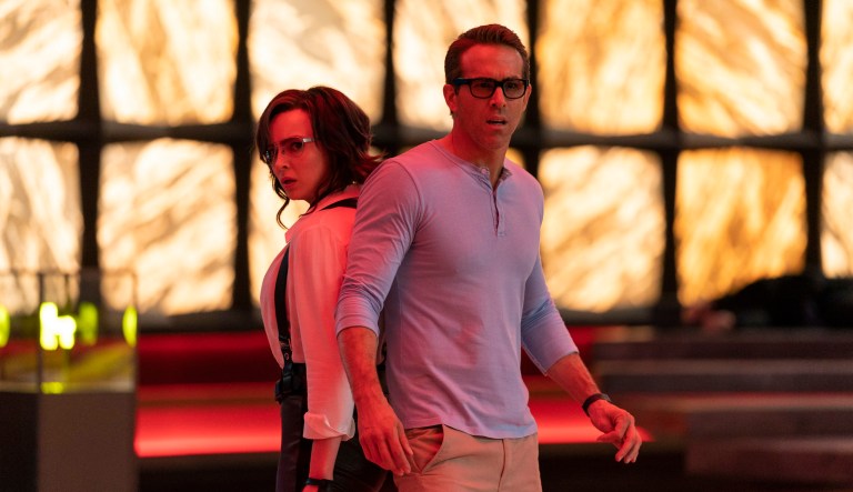 This image released by 20th Century Studios shows Jodie Comer, left, and Ryan Reynolds in a scene from 