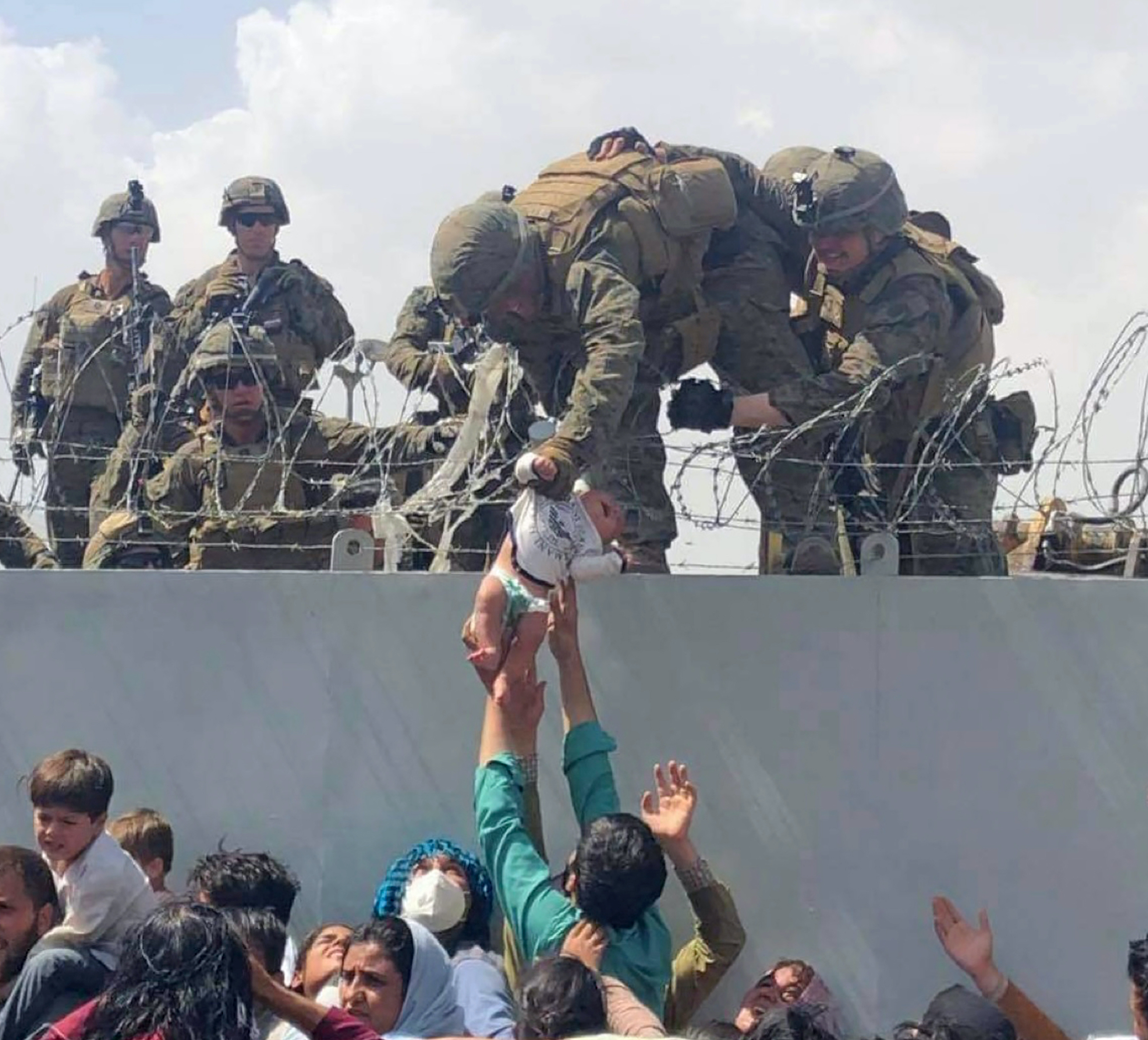 Baby lifted over Kabul wall relocated to Arizona