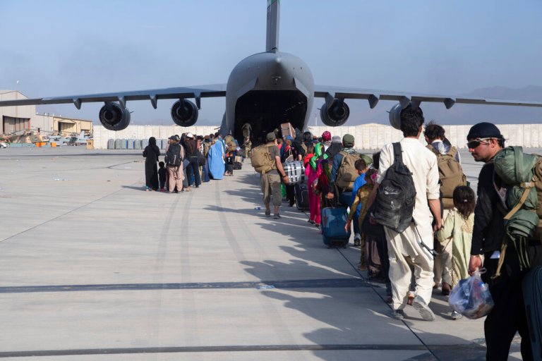 Hundreds of thousands donated frequent flyer miles help move Afghan refugees
