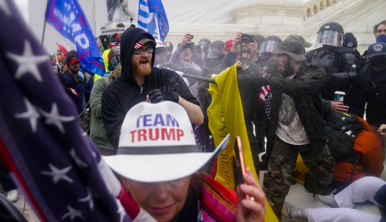 In this Jan. 6, 2021, file photo, insurrections loyal to President Donald Trump try to break through a police barrier at the Capitol in Washington.