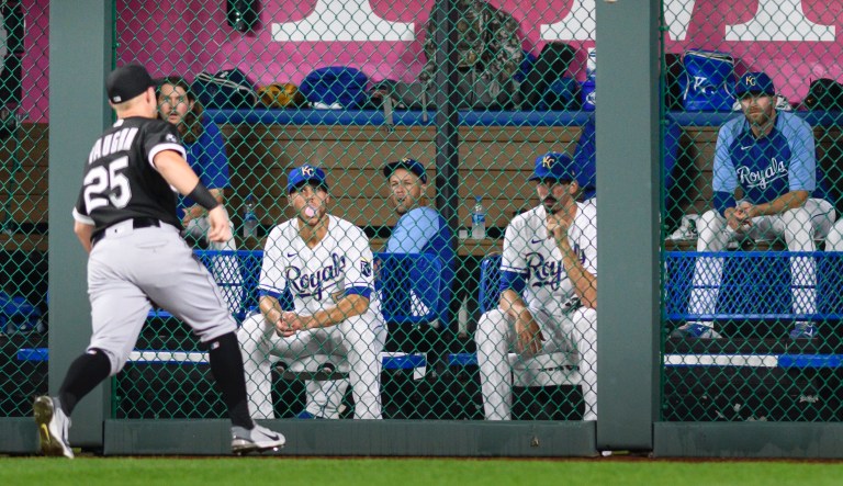 The Kansas City Royals bullpen watches Chicago White Sox right fielder Andrew Vaughn (25) chase this double by Kansas City Royalsâ Andrew Benintendi during the fourth inning of a baseball game, Friday, Sept. 3, 2021 in Kansas City, Mo.