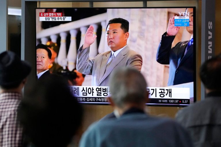 People watch a TV showing North Korean leader Kim Jong Un during a military parade held in Pyongyang, North Korea, at Seoul Railway Station in Seoul, South Korea, Thursday, Sept. 9, 2021.