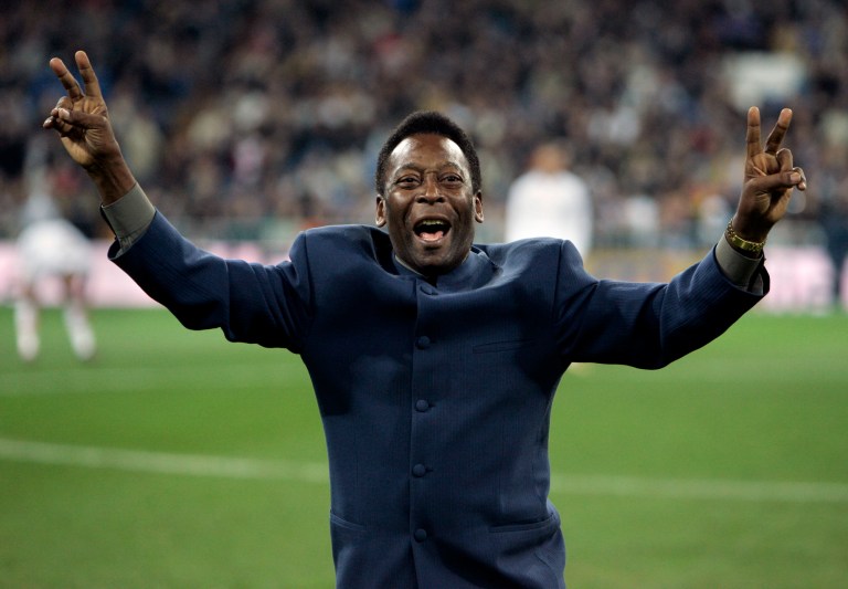 Brazil's soccer legend Pele greets the crowd ahead of a Spanish league soccer match, in the Santiago Bernabeu stadium in Madrid, Jan. 16, 2005. Pele, the Brazilian king of soccer who won a record three World Cups and became one of the most commanding sports figures of the last century, died in Sao Paulo on Thursday, Dec. 29, 2022. He was 82. 