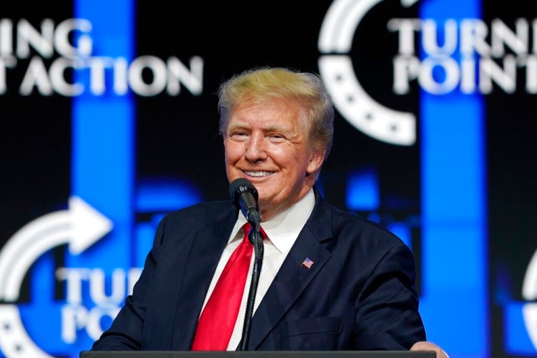 FILE - In this July 24, 2021, file photo former President Donald Trump smiles as he pauses while speaking to supporters at a Turning Point Action gathering in Phoenix. As he mulls a comeback run for president in 2024, former President Donald Trump has been wading into local secretary of state and attorney general races in key swing states.