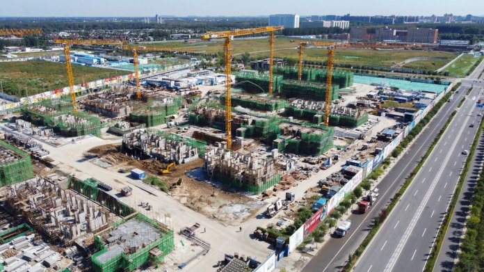 An aerial view shows an Evergrande new housing development project under construction in Beijing, Wednesday, Sept. 22, 2021. (AP Photo)