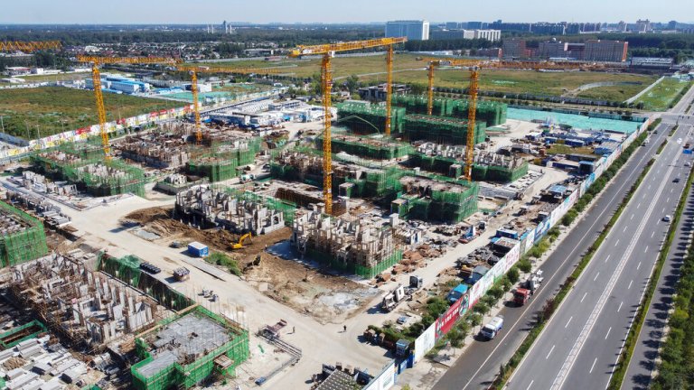 An aerial view shows an Evergrande new housing development project under construction in Beijing, Wednesday, Sept. 22, 2021. (AP Photo)