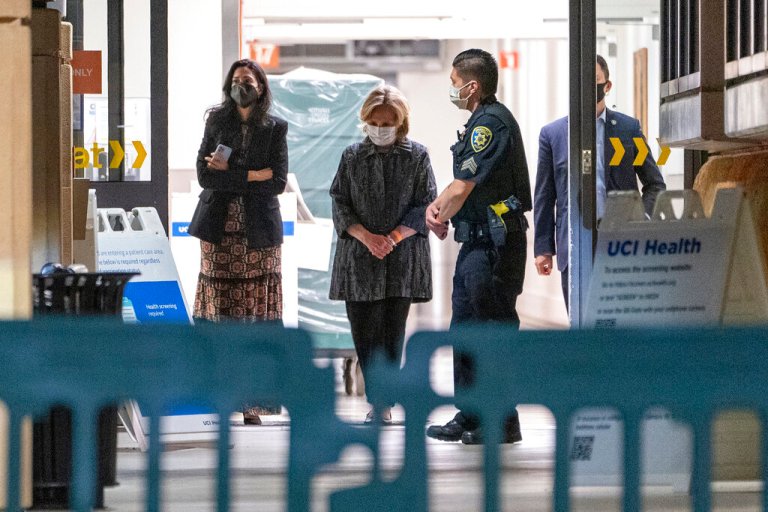 Former first lady and former U.S. Secretary of State Hillary Clinton, middle, exits the University of California Irvine Medical Center in Orange, California, Thursday, Oct. 14, 2021.