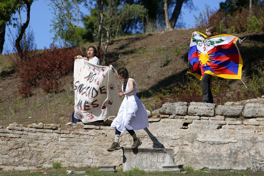 ‘No genocide games’: Activists protest torch-lighting for 2022 Beijing Winter Olympics