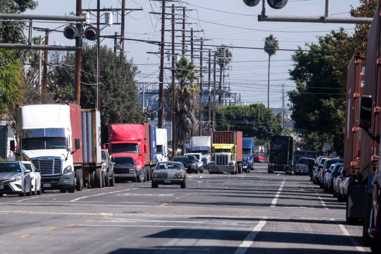 Parked cargo container trucks are seen in a street in Wilmington, Calif., in 2021.California air regulators and truck manufacturers reached a deal Thursday on vehicle emissions, prompting outcry from some states, including Iowa, who vowed to challenge the agreement in court. (AP/Ringo H.W. Chiu)
